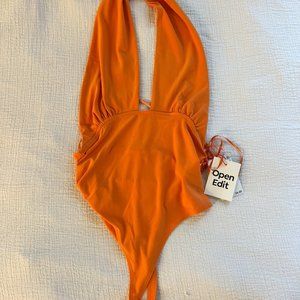 Backless orange halter bodysuit